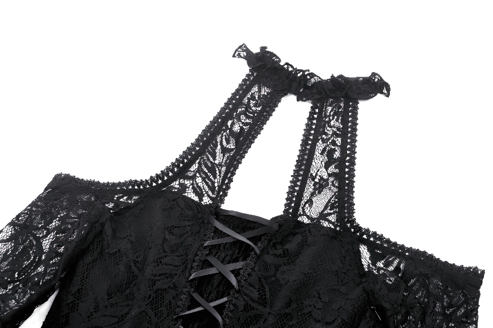 Close-up of black gothic lace dress showcasing open shoulders, intricate lace detailing, and ruffled trim.