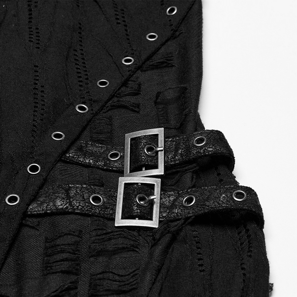 Close-up of black gothic lace dress showcasing eyelets and buckle details in asymmetric design.