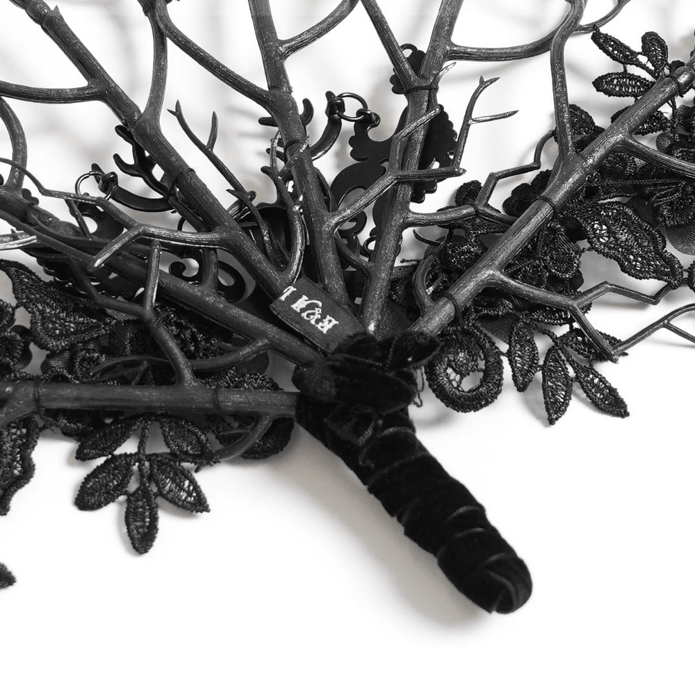 Alt Tag: Black Gothic Lace Hand Fan with Floral Branch Detail with branching filigree, floral lace appliqué, ornate Victorian openwork silhouette