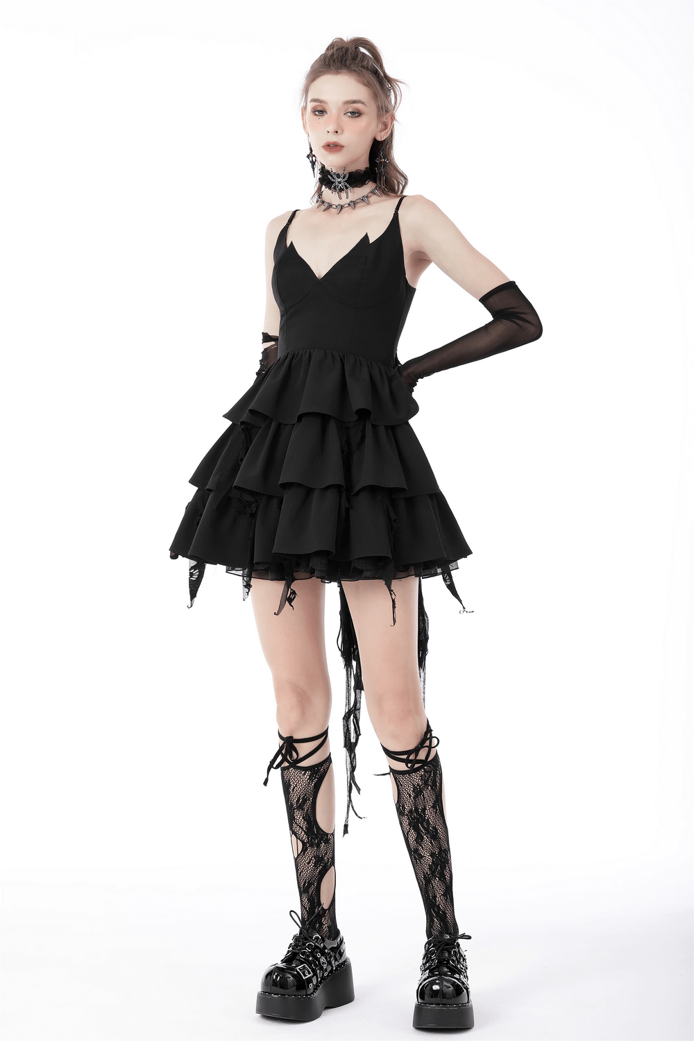 Black Gothic high-low dress with plunging neckline, ruffled layers, and edgy fringe detailing.