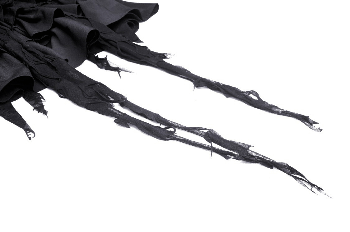 Close-up of black lace fabric with edgy fringe detailing, perfect for a gothic high-low dress.