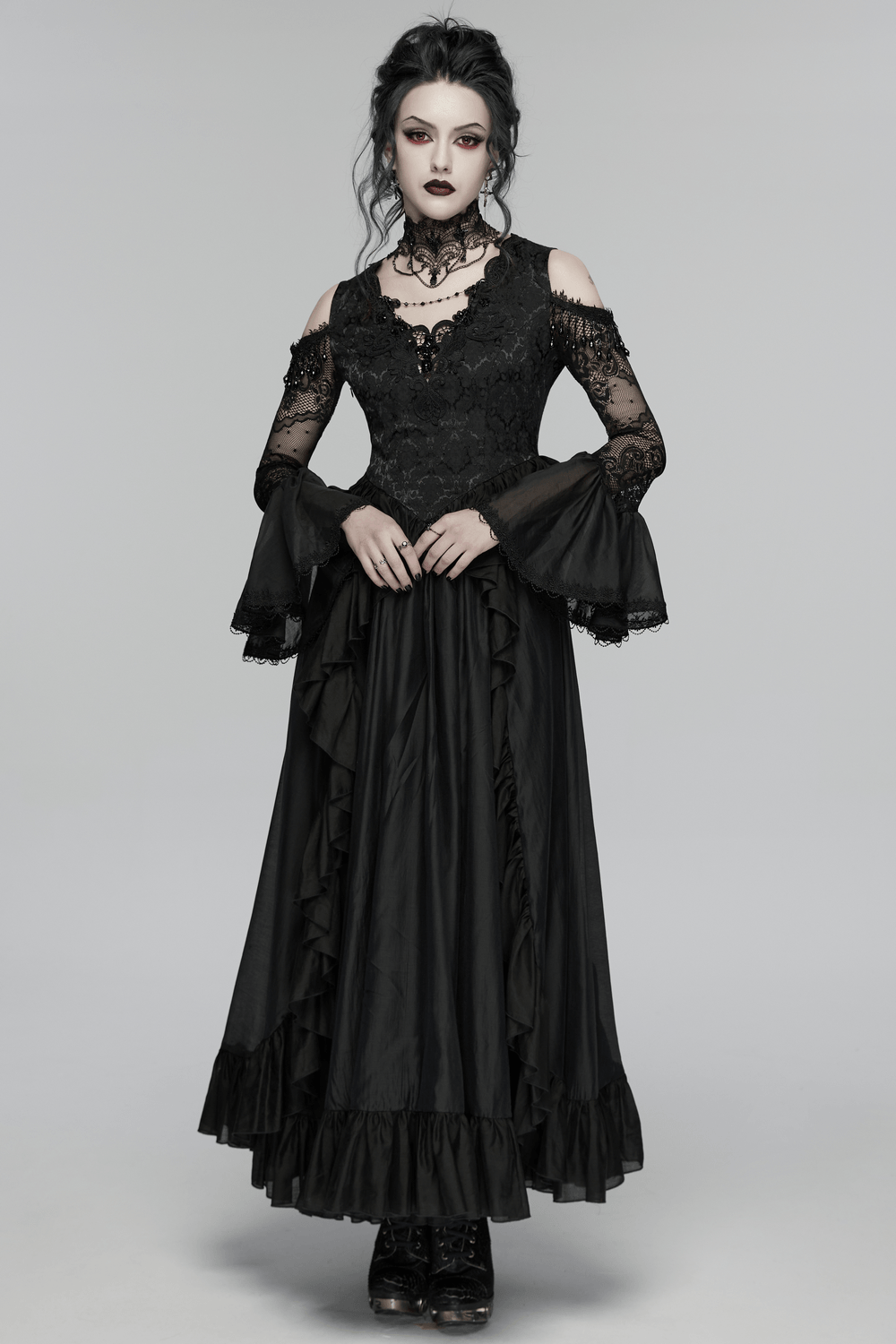 Alt Tag: Black Gothic Lace Maxi Dress with Ruffle Sleeves with sheer lace cold-shoulder sleeves, ruffle skirt, crystal pendant detail