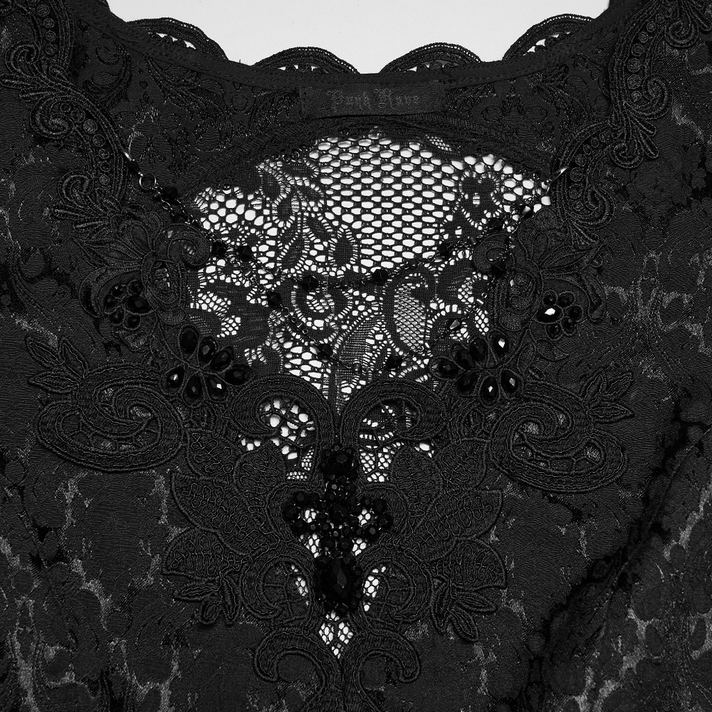 Alt Tag: Black Gothic Lace Maxi Dress with Ruffle Sleeves close-up of sheer lace bodice with floral embroidery, pearl flowers and crystal pendant detail