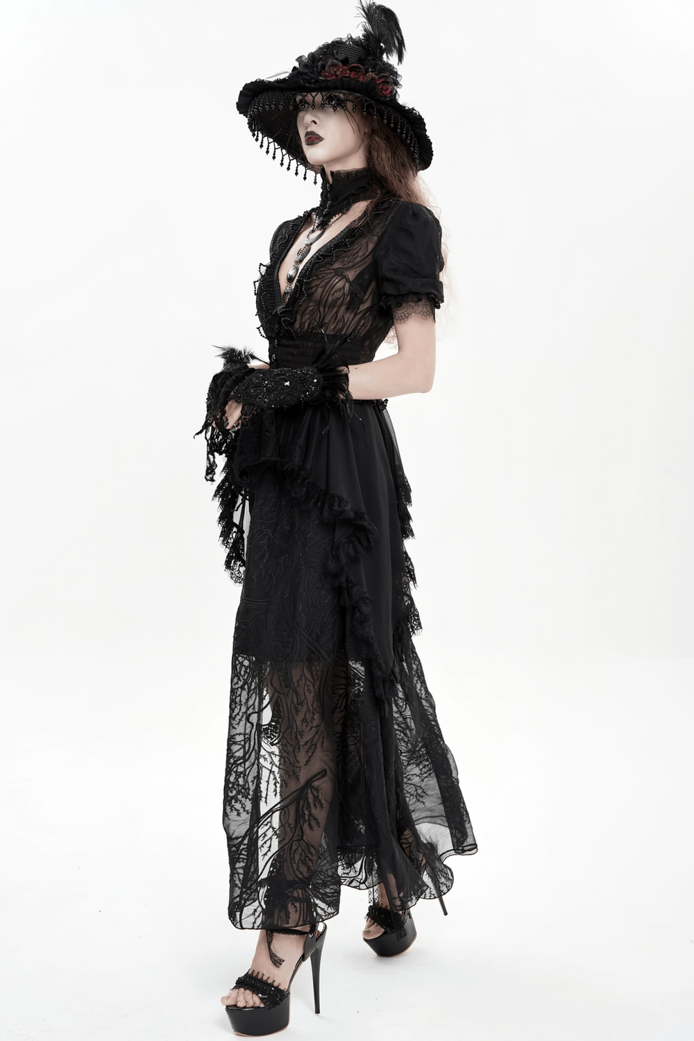 Alt Tag: Black Gothic Lace Mesh Maxi Dress with Short Sleeves on model, sheer lace high neck, puff sleeves, ruffled high-low hem, lace-up back