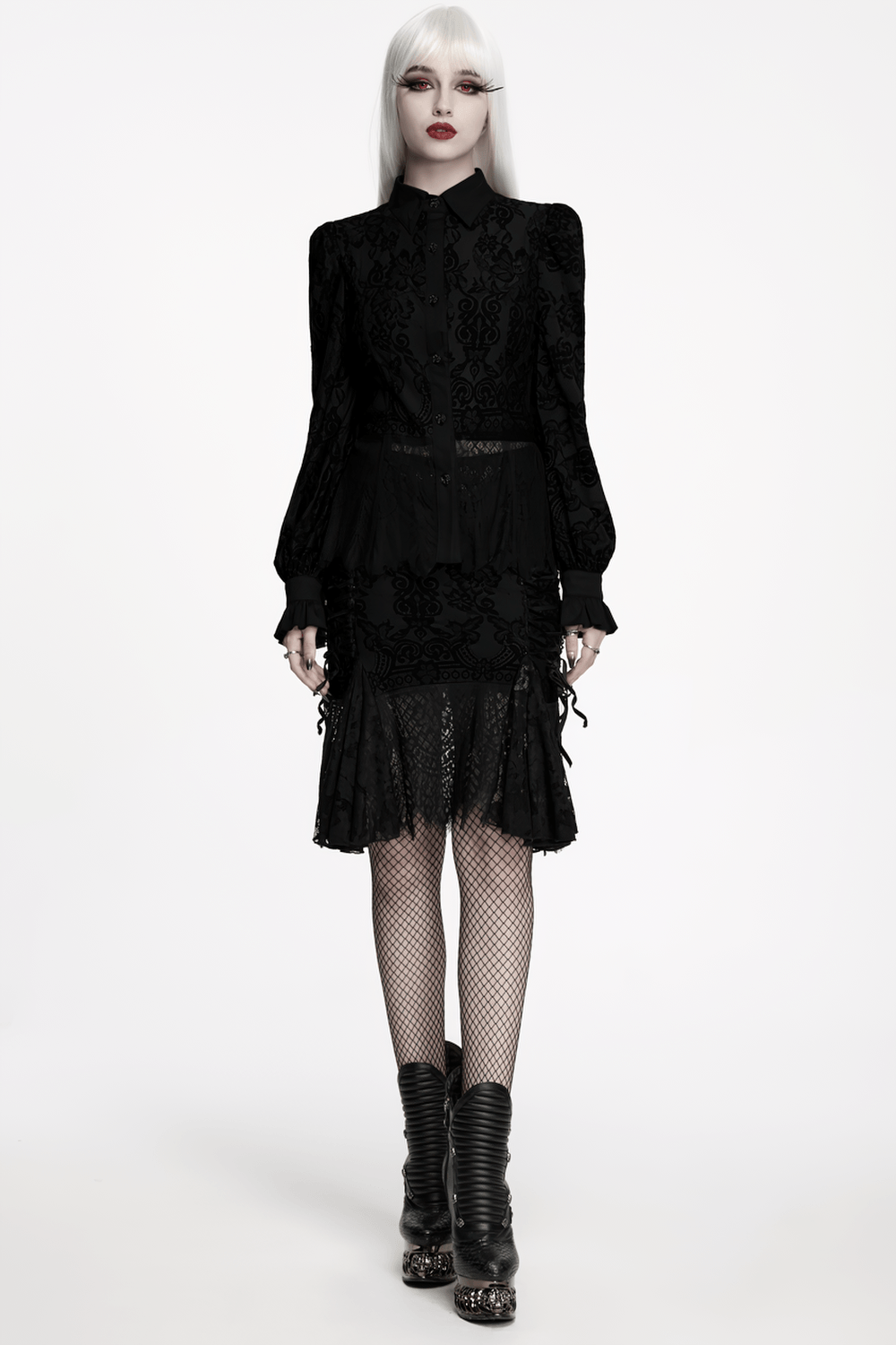 Black Gothic Lace Shirt with Corset Back and Ruffle Hem showcased by a model in a dramatic pose, wearing fishnet tights and edgy boots.