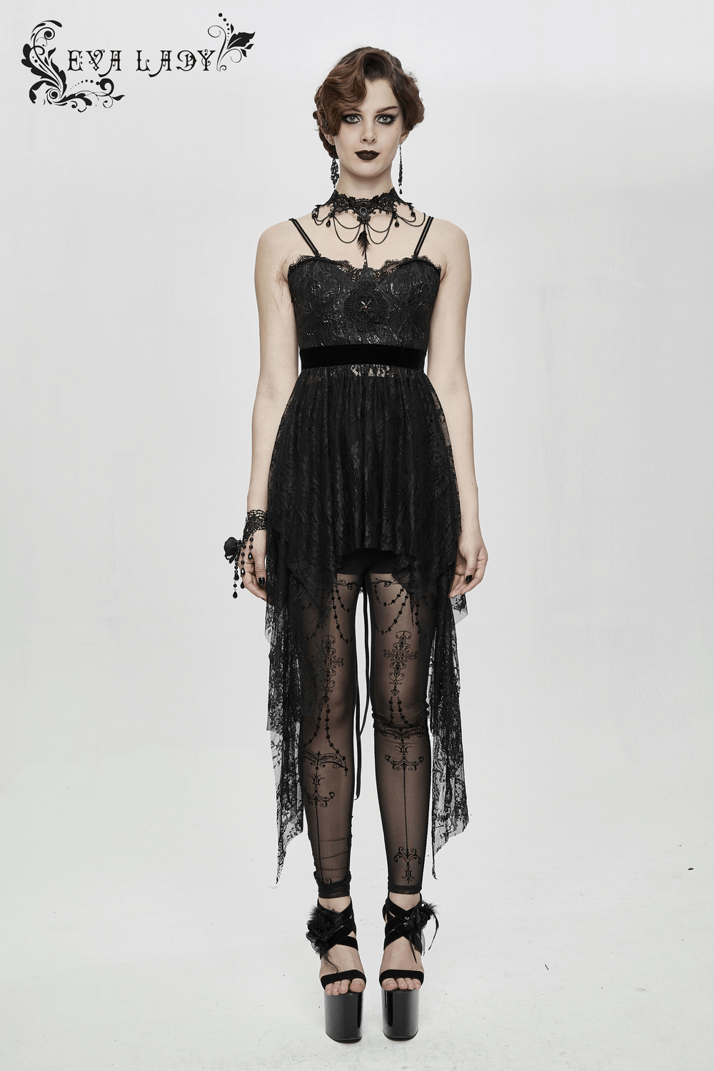 Elegant model in a black Gothic lace sleeveless dress with asymmetrical hem and striking red beading for a chic look.
