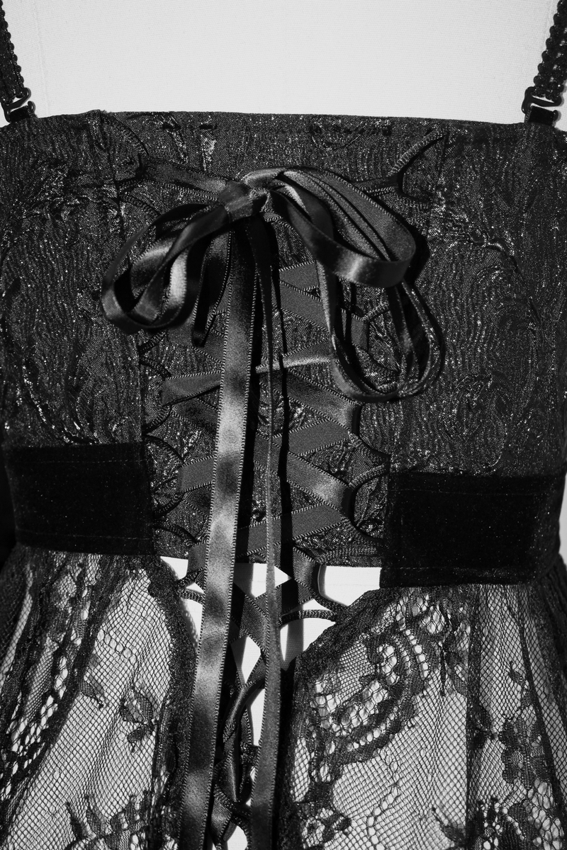 Close-up of the back of a black gothic lace dress featuring a ribbon tie and intricate lace design.