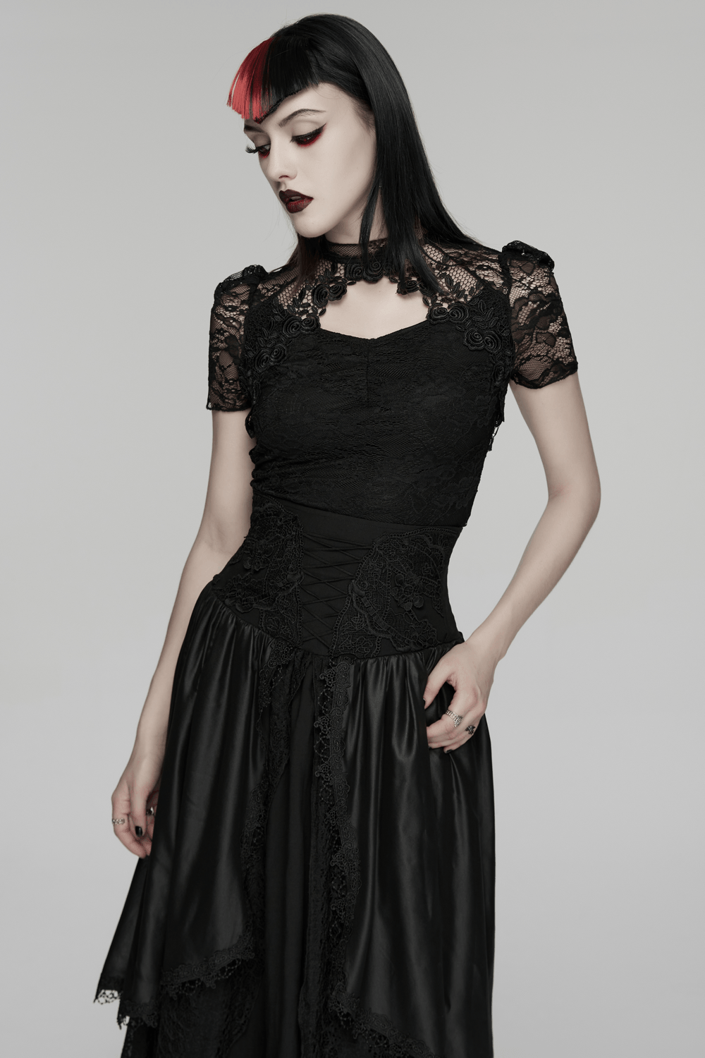 Black Gothic Lace Top with Puff Sleeves Detail worn by a model showcasing its elegant Victorian design and floral lace.