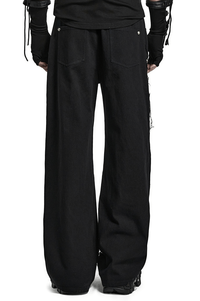 Back view of black gothic lace-up chain cargo pants for men, featuring a ripped design and edgy texture.
