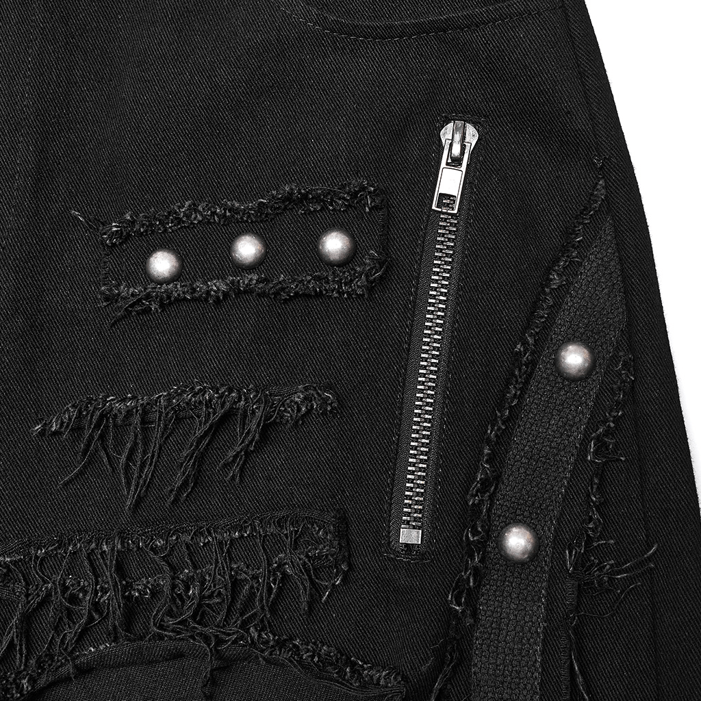 Close-up of black gothic lace-up cargo pants with ripped details and metal rivets for a punk style.