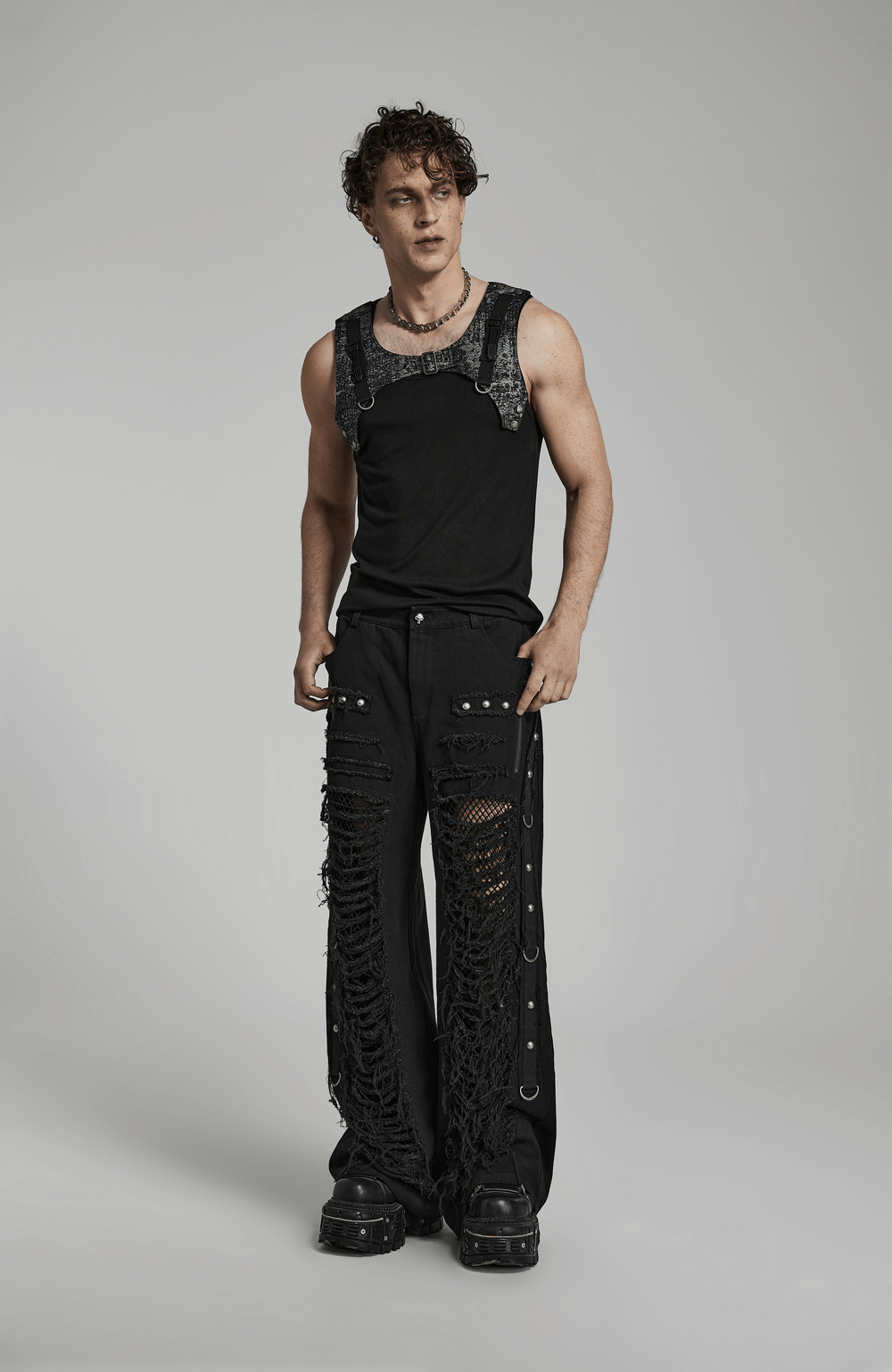 Black gothic lace-up cargo pants for men, featuring punk chain details and edgy ripped design.