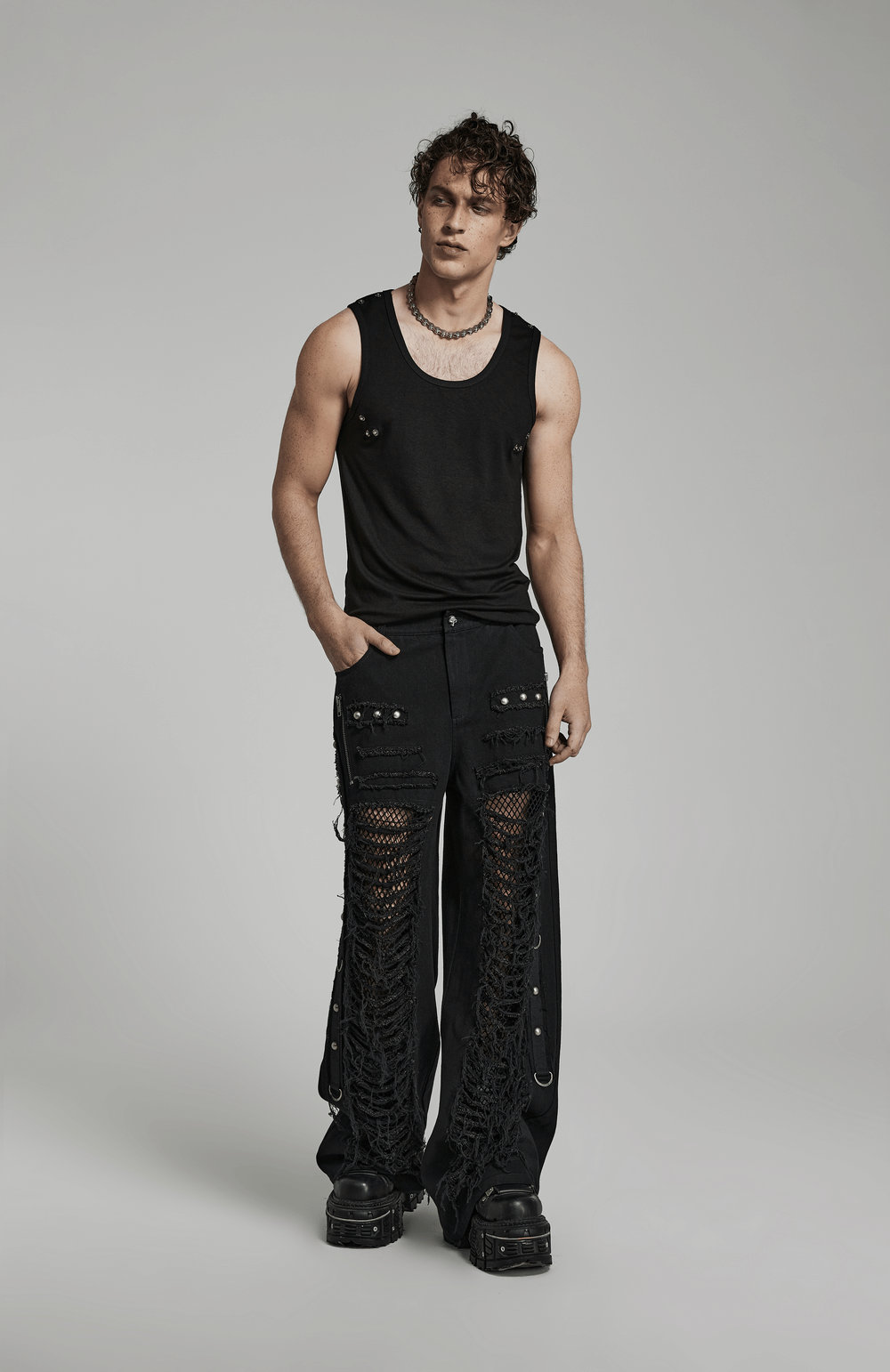 Men's black gothic lace-up cargo pants with side ribbons and edgy ripped details, perfect for a punk style.