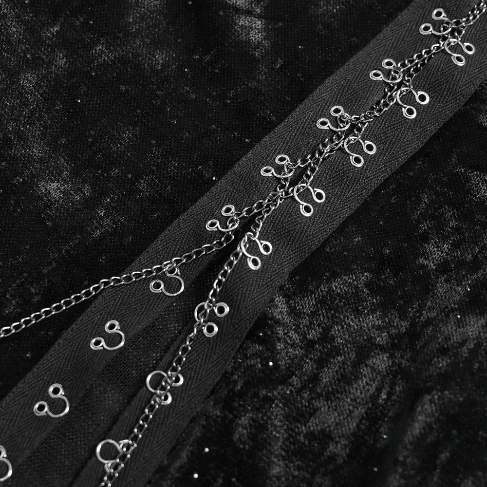 Detail view of the lace-up feature on the Black Gothic Lace Up Maxi Dress with Bell Sleeves.