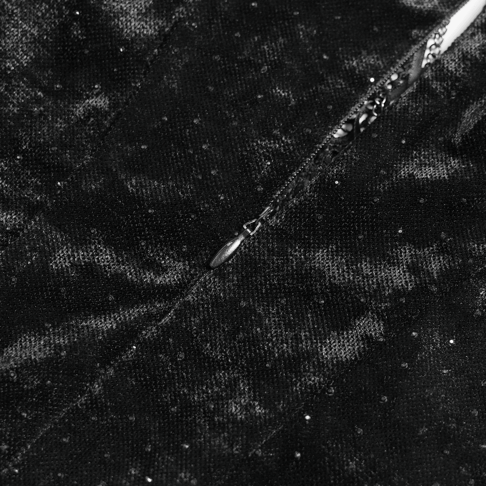 Close-up of the fabric texture of a Black Gothic Lace Up Maxi Dress with Bell Sleeves featuring sparkly details.