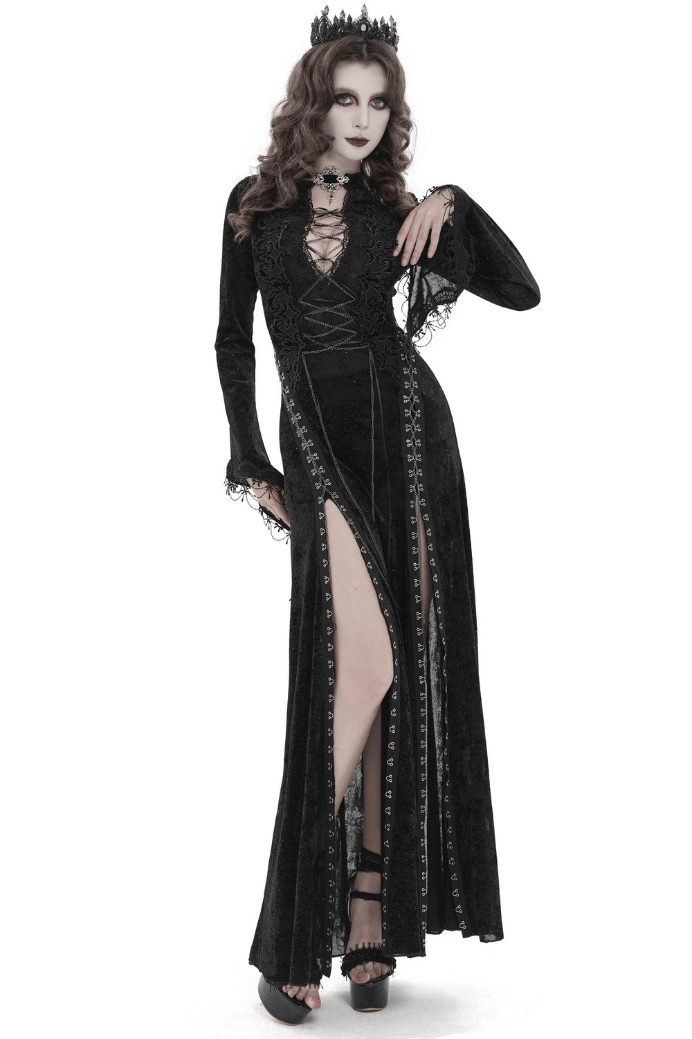 Black Gothic Lace Up Maxi Dress with Bell Sleeves worn by a model, showcasing its elegant design and dramatic slit.