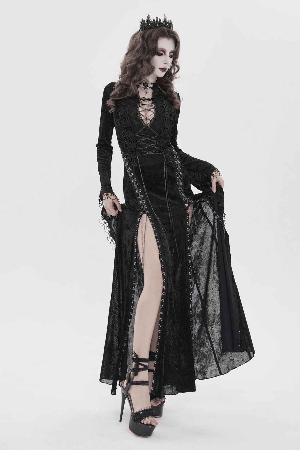 Black Gothic Lace Up Maxi Dress with Bell Sleeves worn by a model with a crown and dramatic makeup.