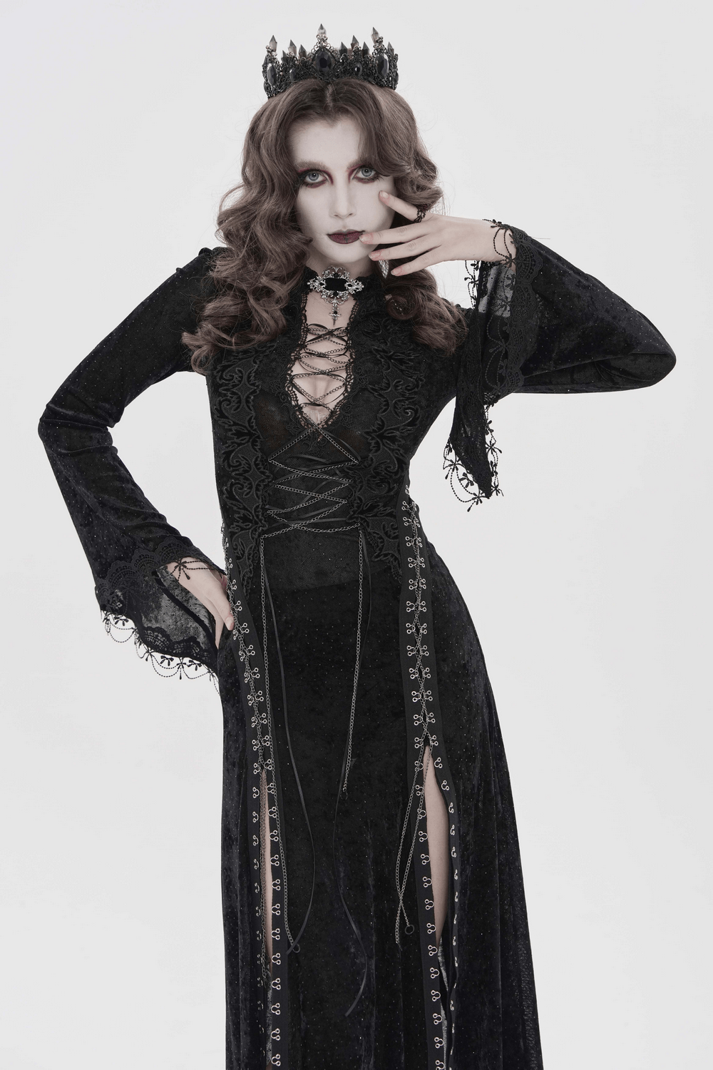 Black Gothic Lace Up Maxi Dress with Bell Sleeves worn by a model posing with a crown and dramatic makeup.