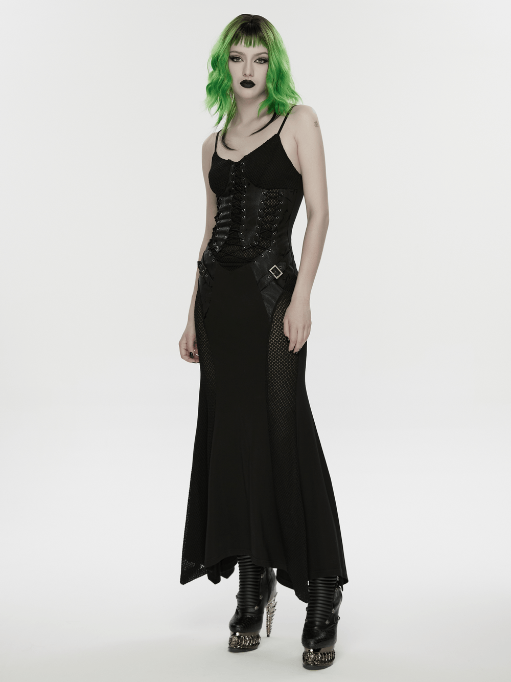Alt Tag: Black Gothic Lace-Up Mermaid Fishnet Maxi Dress on model, corset lace-up bodice, fishnet mesh panels, irregular hem, punk goth vibe