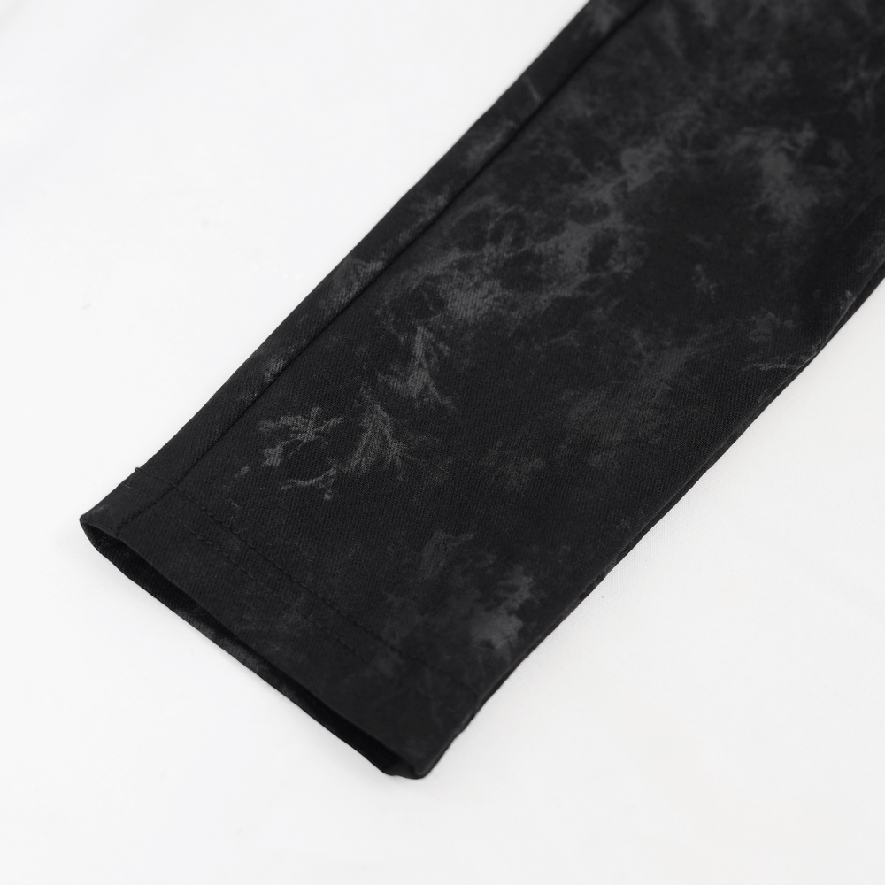 Close-up of black gothic lace-up pants featuring ripped accents and a stylish matte finish. Perfect for alternative fashion.