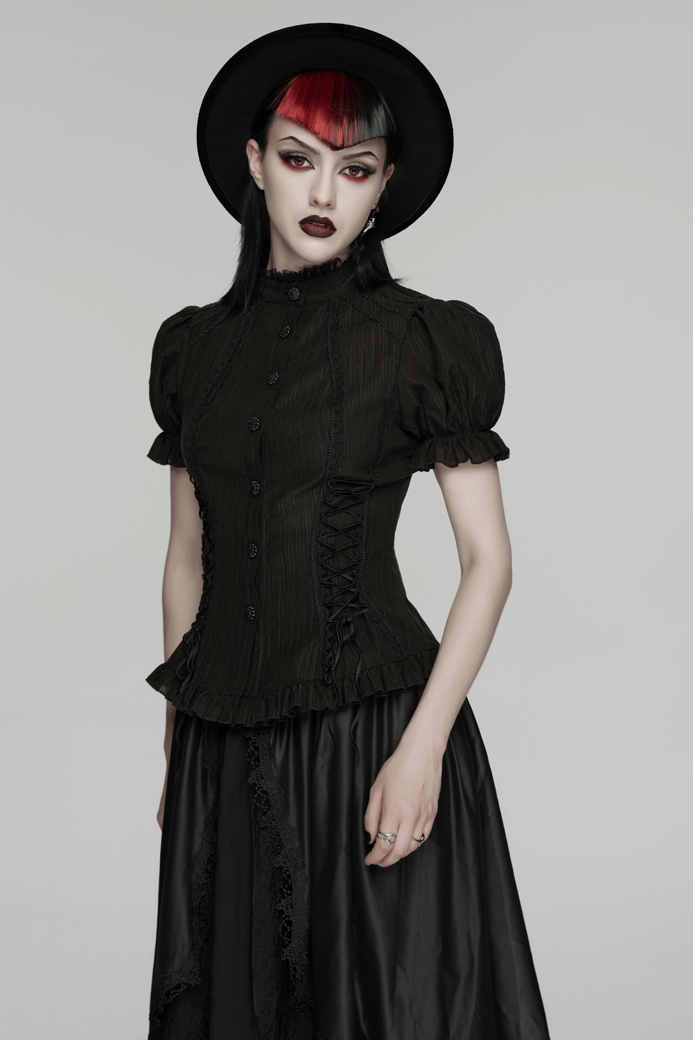 Black Gothic Lace-Up Puff-Sleeved Button Shirt model wearing black hat and stylish makeup