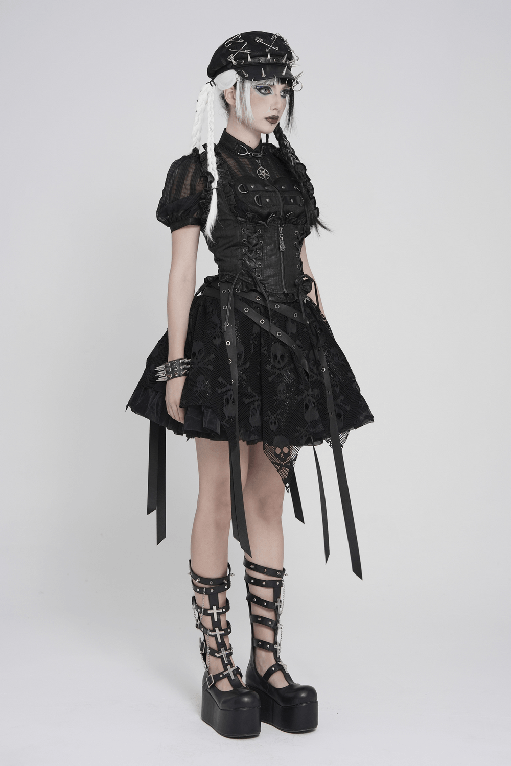 Black Gothic Lace Up Ruffle Waistcoat for Women styled with a short skirt and platform boots on a model.