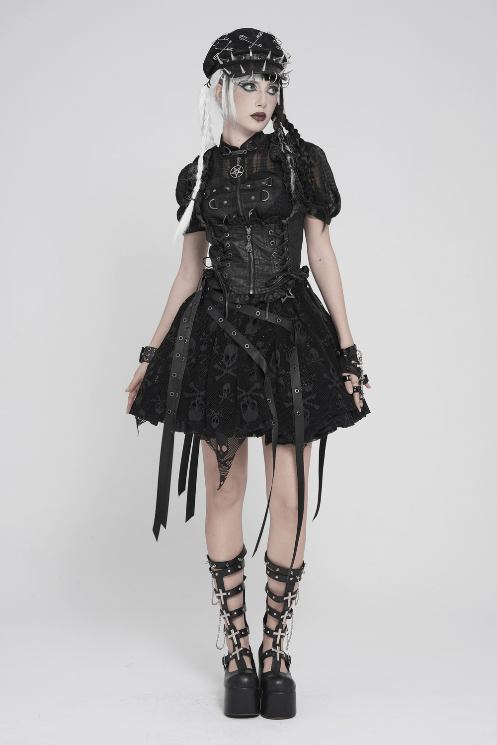 Black Gothic Lace Up Ruffle Waistcoat for Women styled with a playful black skirt and edgy accessories, perfect for alternative fashion.