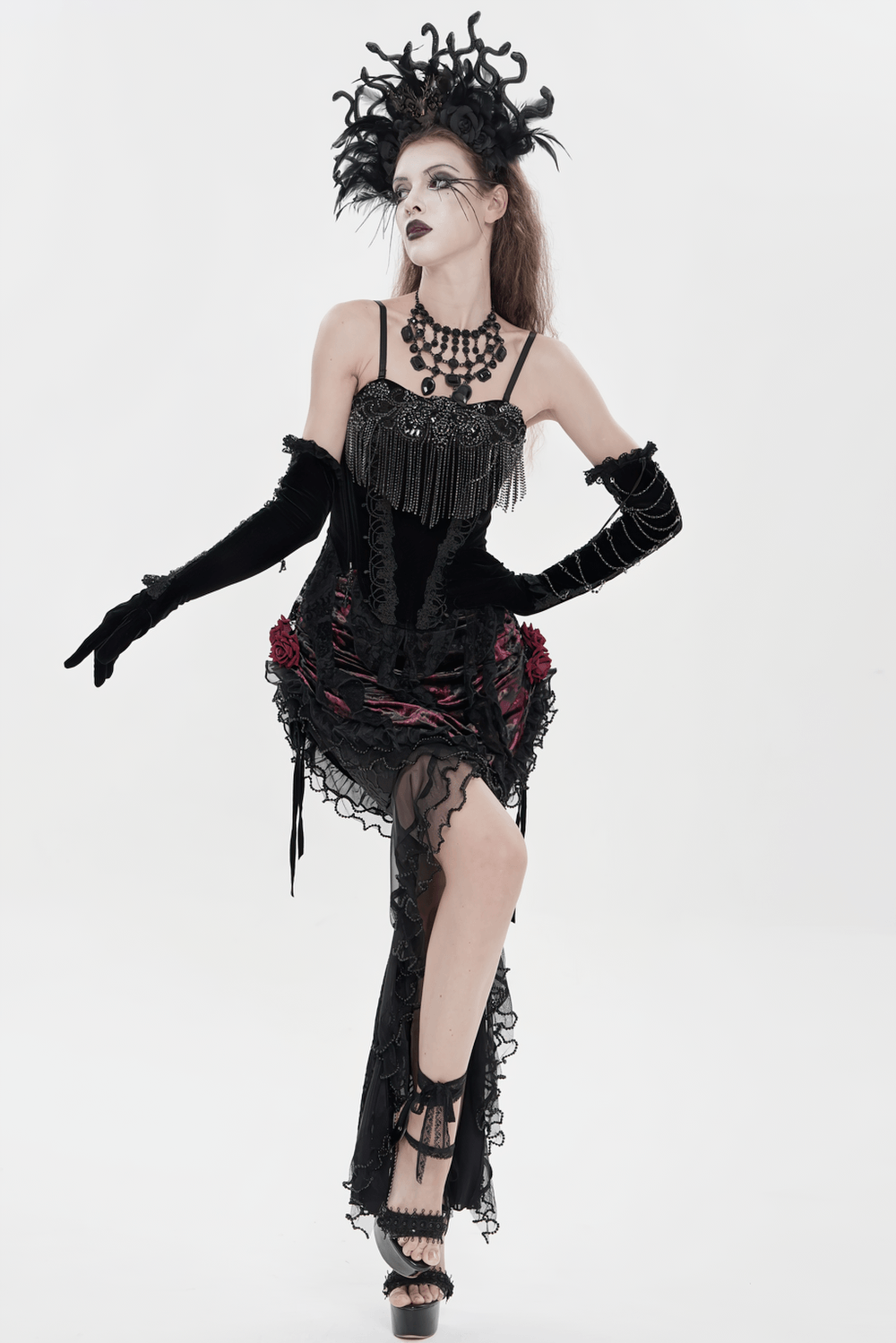 Alt Tag: Black Gothic Lace-Up Velvet Fringe Corset Top on model in dramatic gothic look, black lace fringe corset, long gloves, statement headpiece