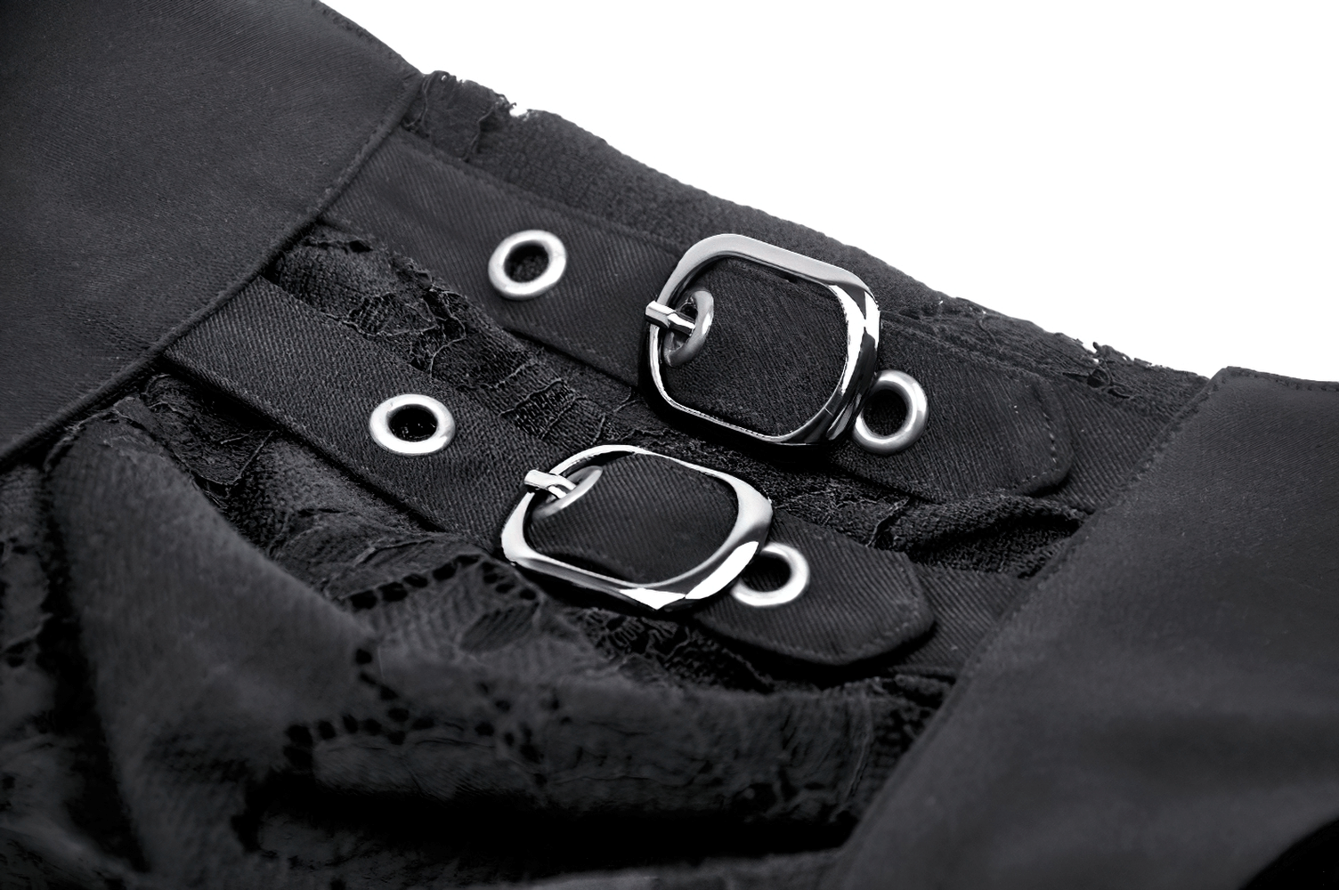 Close-up of black gothic layered lace skirt featuring stylish silver buckles and intricate lace detailing.