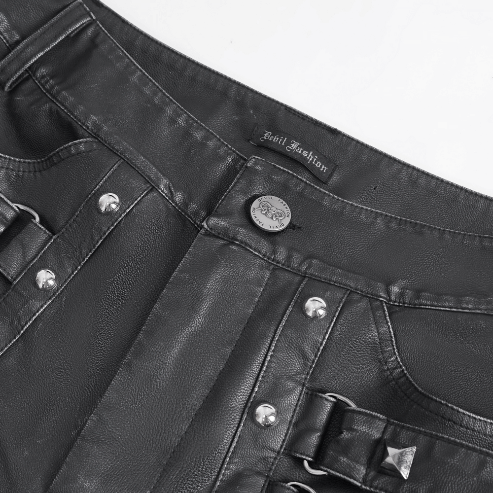 Close-up of black gothic leather pants with buckles and studs for a punk-inspired look.