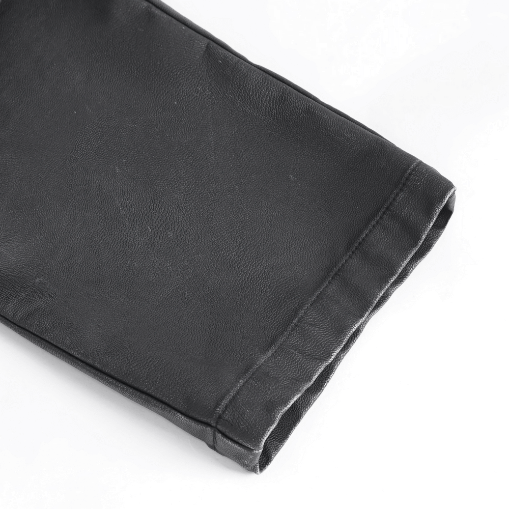 Close-up of black gothic leather pants showcasing the stylish hem and durable material for punk fashion enthusiasts.