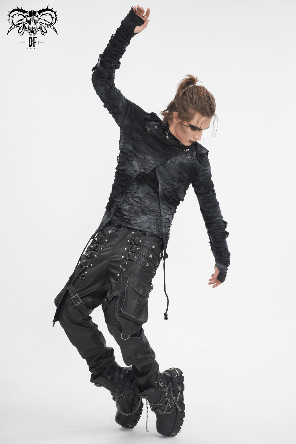 Model showcasing stylish black gothic leather pants with buckles, straps, and edgy punk style.