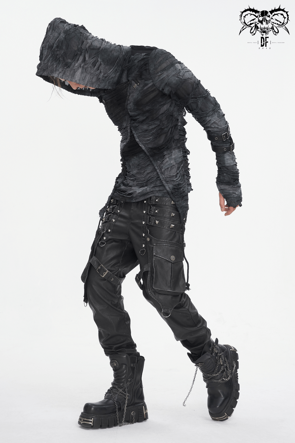 Model wearing edgy black gothic leather cargo pants with buckles and straps, showcasing a punk-inspired look.