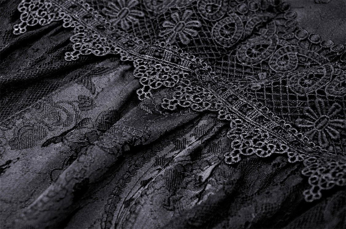 Detailed black lace fabric with intricate floral embroidery, showcasing Victorian gothic elegance.