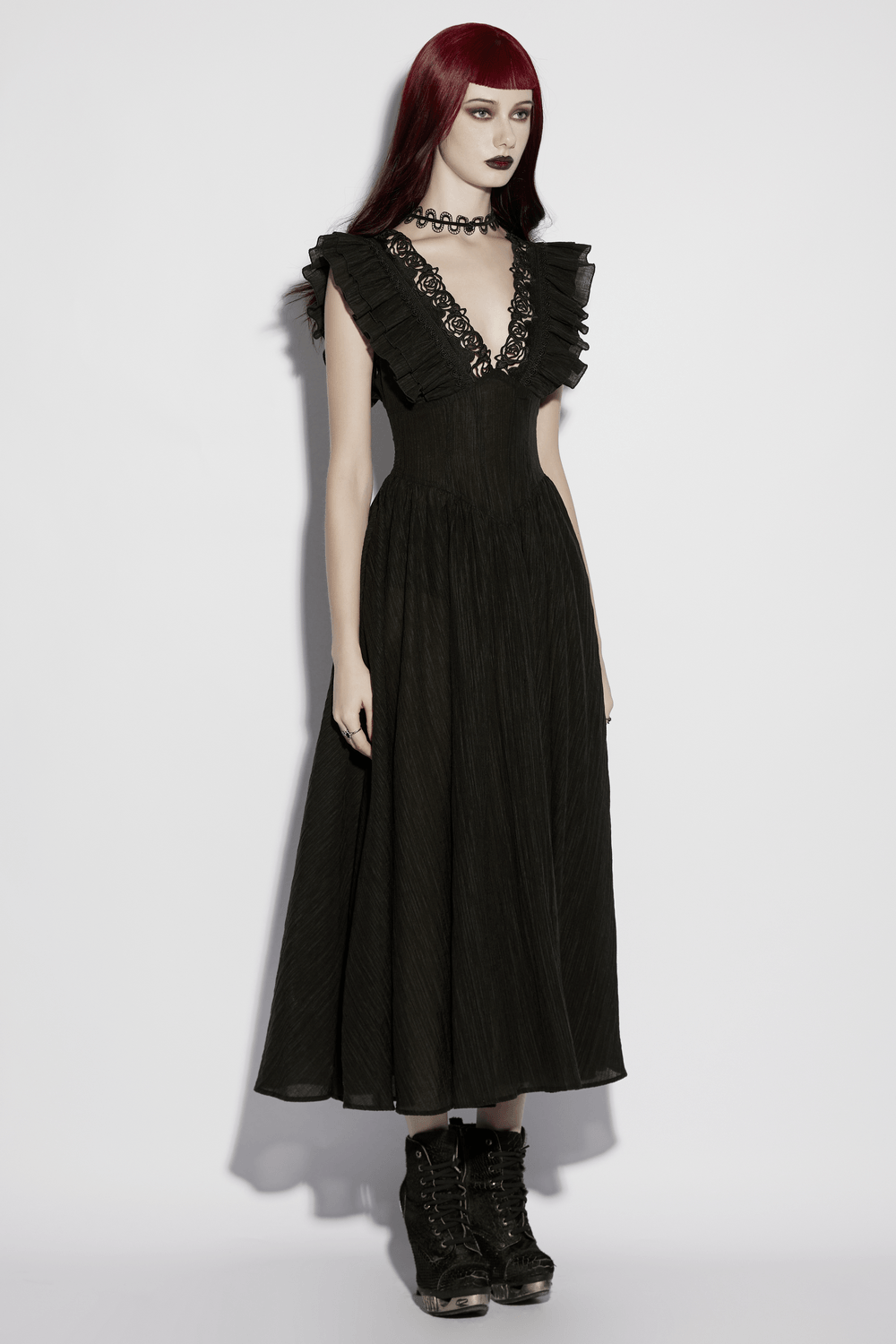 Alt Tag: Black Gothic Maxi Dress with Lace V-Neck and Ruffle Sleeves on model, flowing black maxi gown with ruffled sleeves