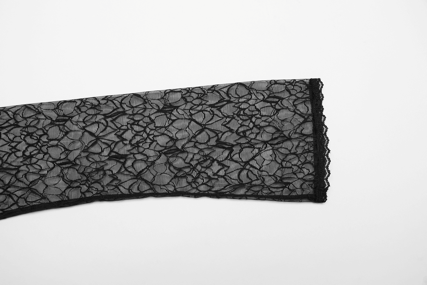 Sheer black mesh fabric with floral pattern and delicate lace trim, perfect for gothic fashion or stylish layering.