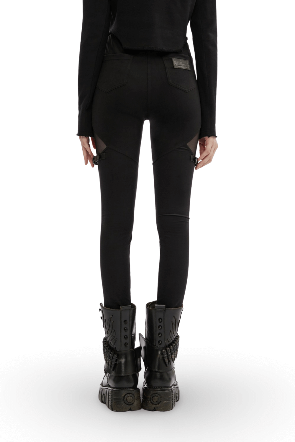 Back view of black gothic mesh-panel leggings with buckle accents, paired with edgy black combat boots.