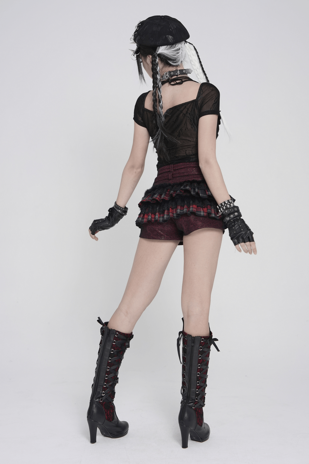 Black Gothic Mesh Short-Sleeved Top with Chains and Lacing worn by a model showcasing edgy style from the back.