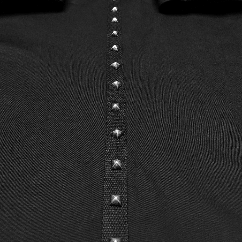 Close-up of black gothic mesh vest featuring striking metal eyelet accents for a bold fashion statement.