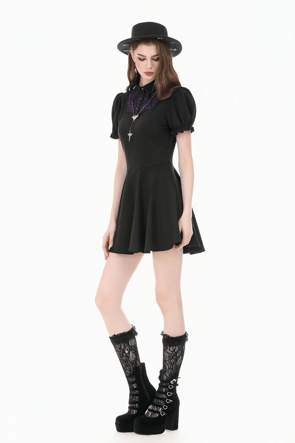 Model wearing a Black Gothic Mini Dress with Purple Lace Yoke, featuring puff sleeves and a flared skirt.