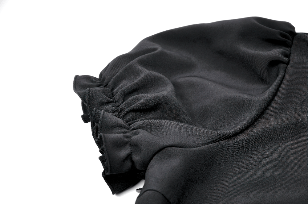 Close-up of the puff sleeve detail on the Black Gothic Mini Dress with Purple Lace Yoke.