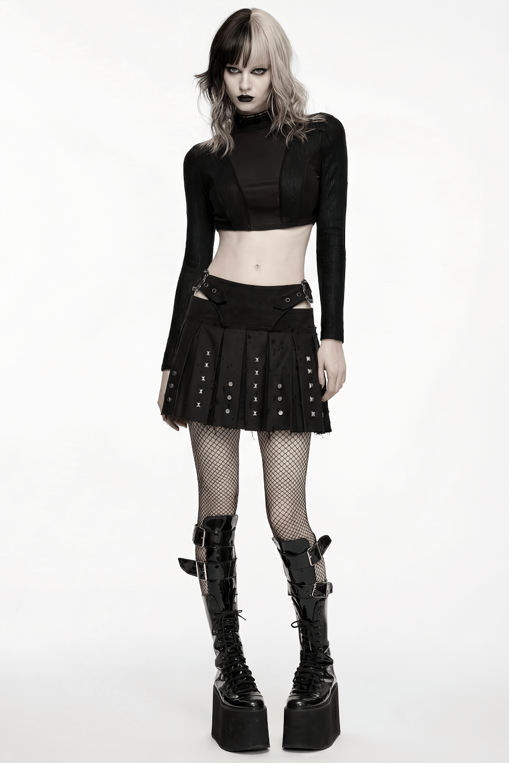 Black Gothic Mini Skirt with Metal Rivet Panels worn with a cropped top and chunky platform boots.