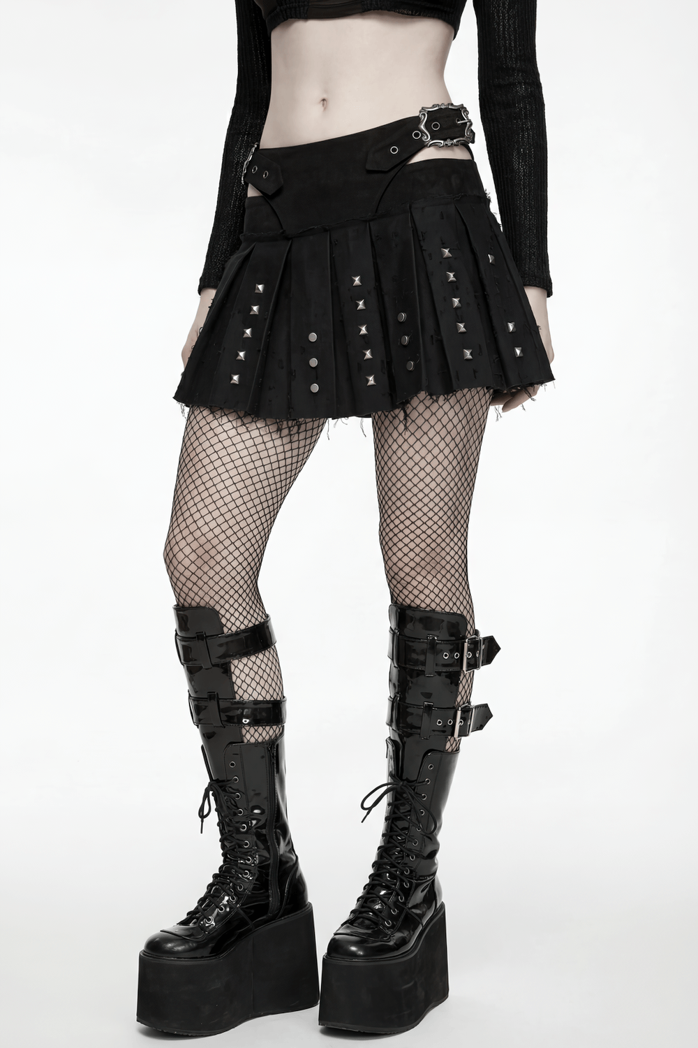 Black Gothic Mini Skirt with Metal Rivet Panels worn with fishnet tights and platform boots.