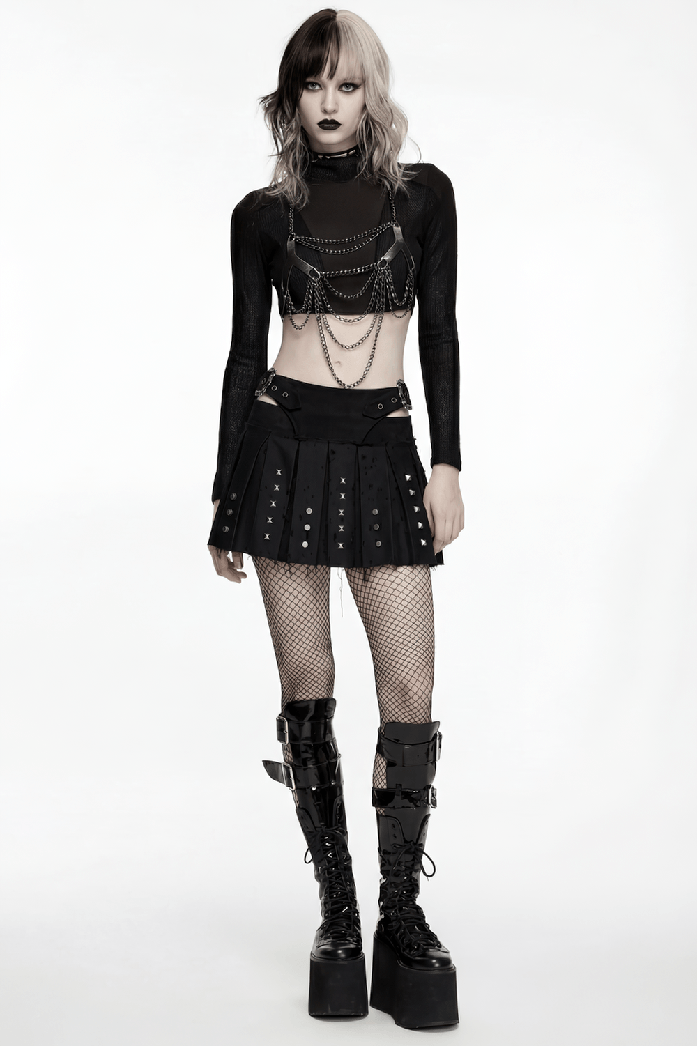 Black Gothic Mini Skirt with Metal Rivet Panels worn with fishnet tights and edgy accessories for a rebellious look.