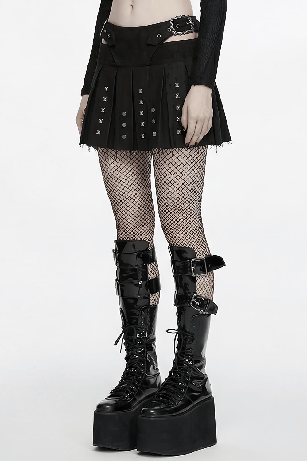 Black Gothic Mini Skirt with Metal Rivet Panels paired with fishnet tights and chunky platform boots.