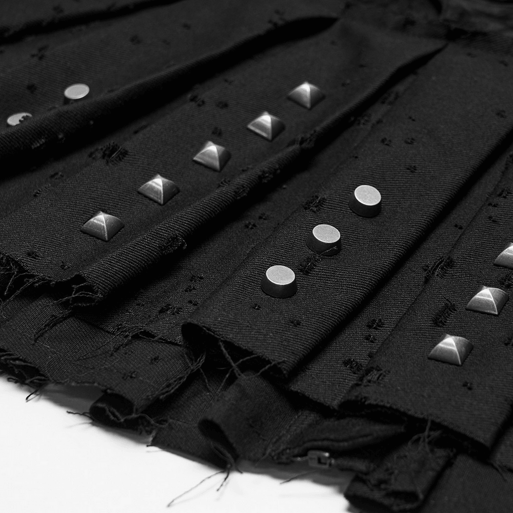 Black Gothic Mini Skirt with Metal Rivet Panels featuring stylish metal studs and distressed fabric.