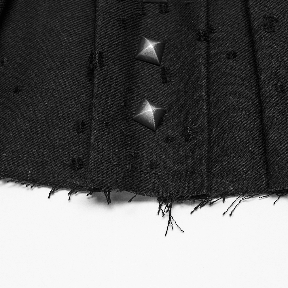 Close-up of Black Gothic Mini Skirt with Metal Rivet Panels showing pleats and cross buckles.