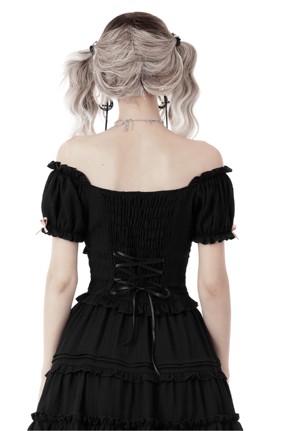 Back view of a black off-the-shoulder top with pink ribbon accents and smocked detailing.
