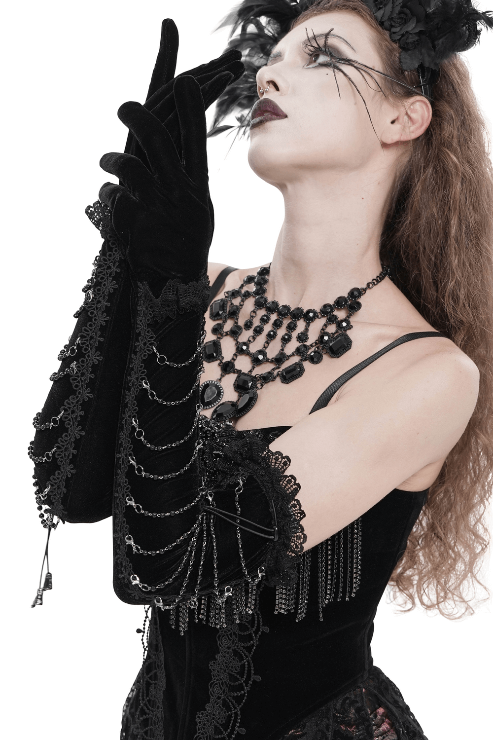 Alt Tag: Black Gothic Opera Gloves with Lace and Chains on model, long velvet over-elbow gloves with lace cuffs and chain wrap for gothic cosplay