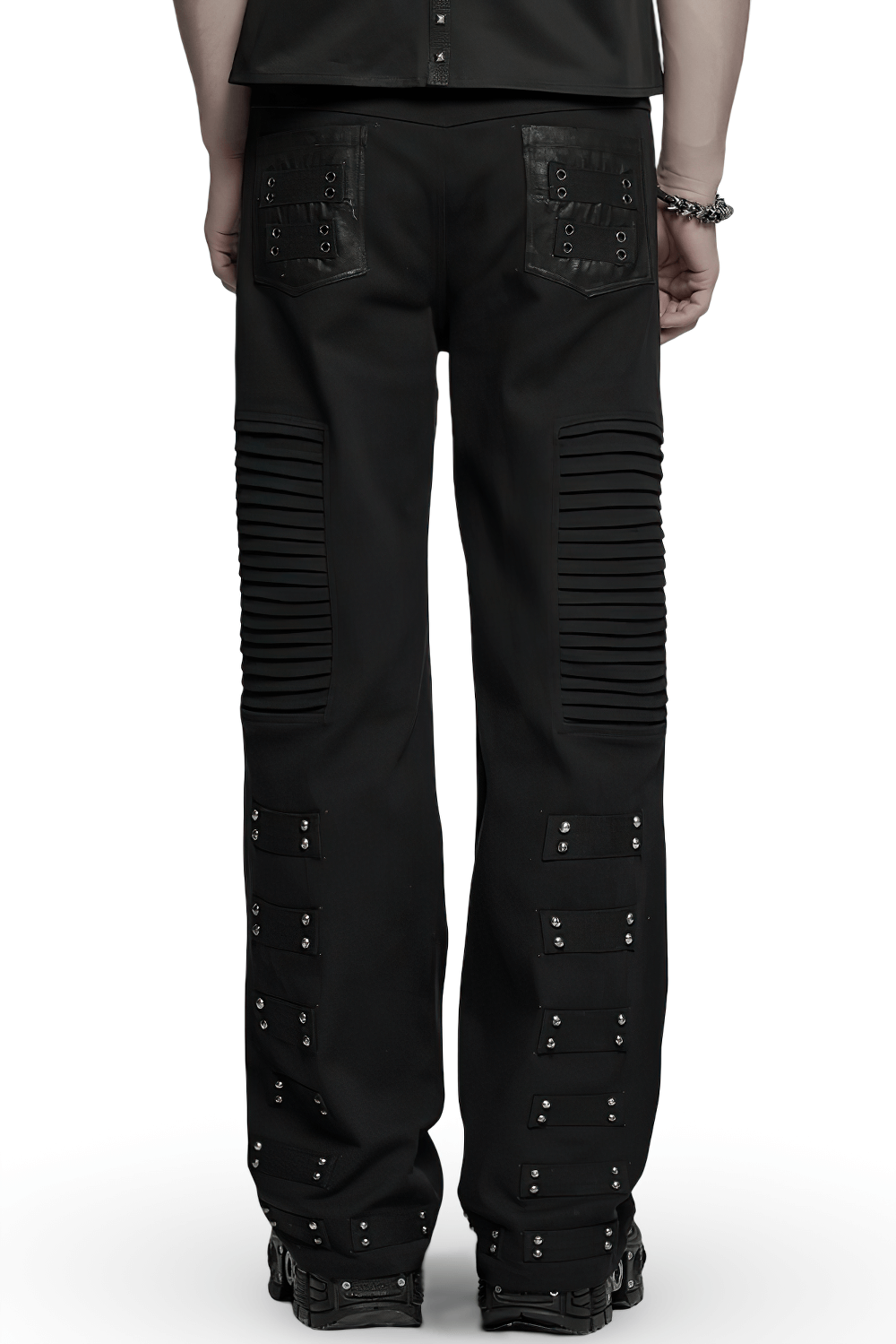 Back view of black gothic pants with pleated panels and rivets, showcasing punk street style and edgy design.