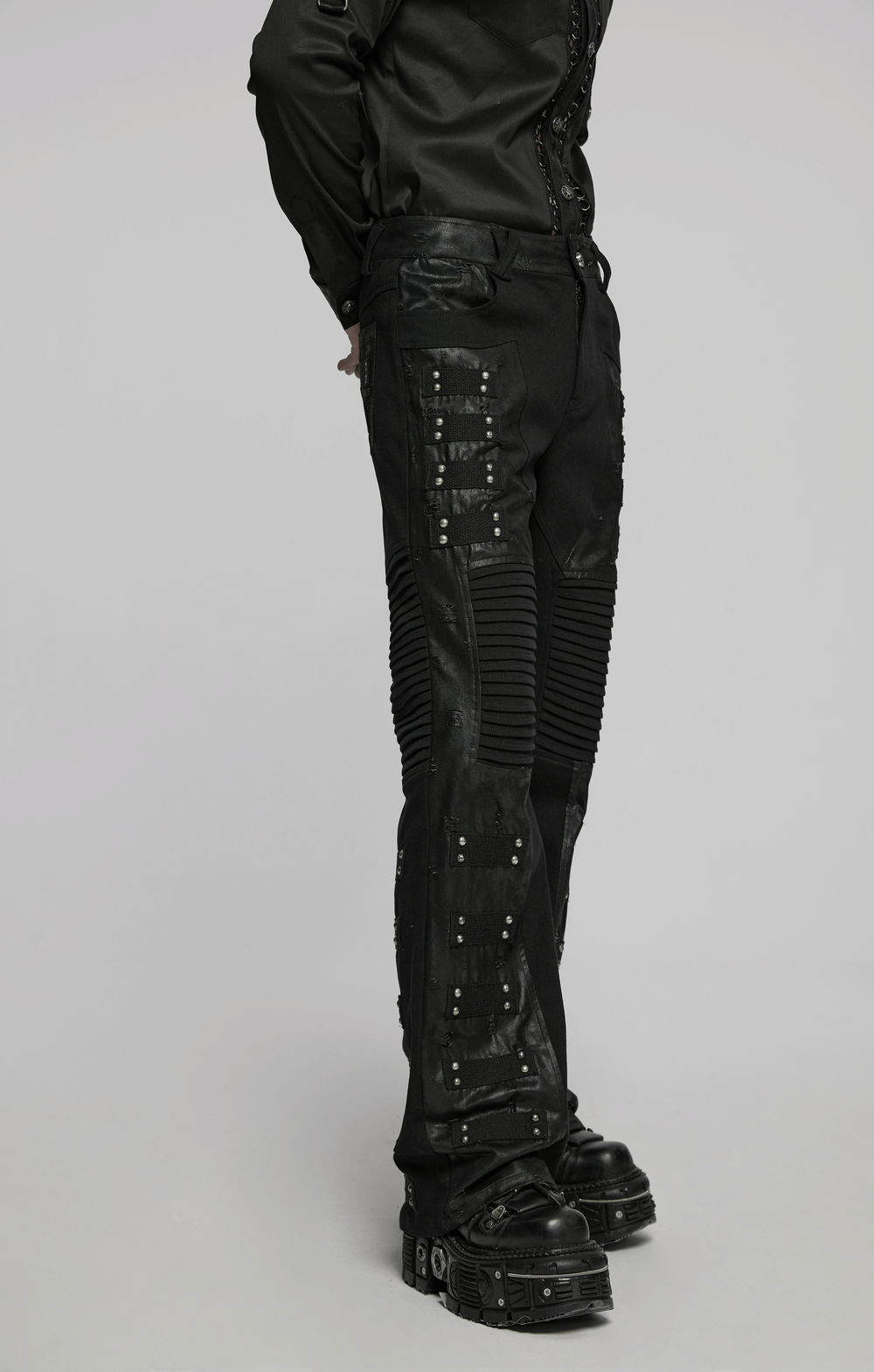 Black gothic pants with pleated panels and rivets, perfect for punk-street fashion statement.